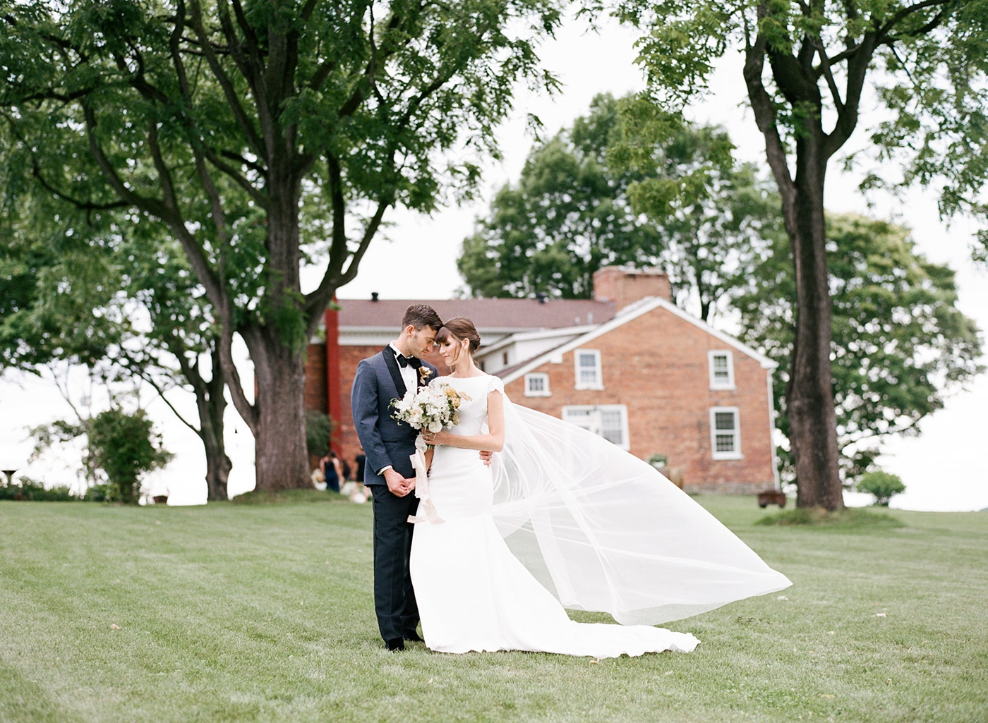 Bride and groom in front of Reed Homstead, Livonia, New York
