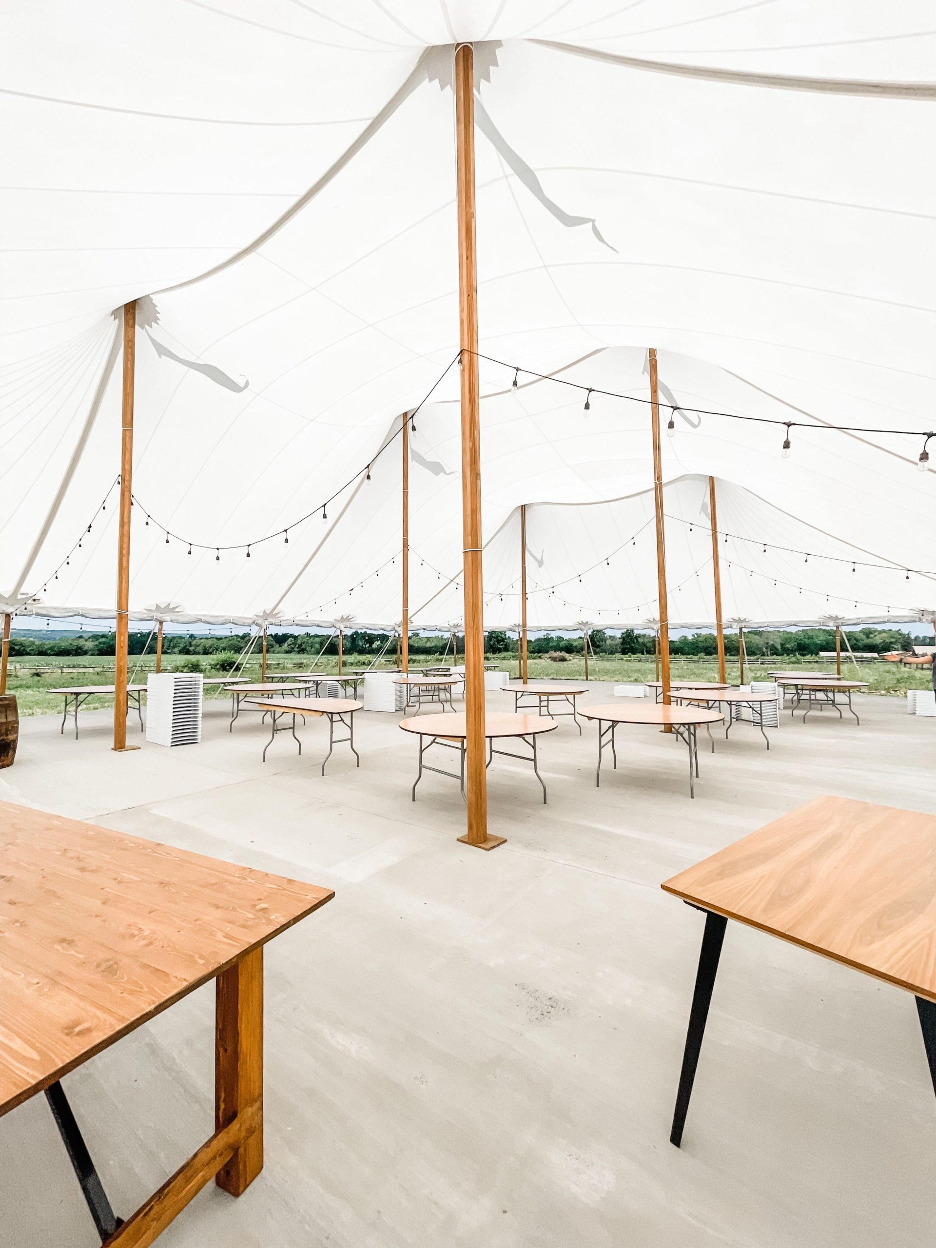 inside the sailcloth outdoor wedding tent at Seneca Ridge