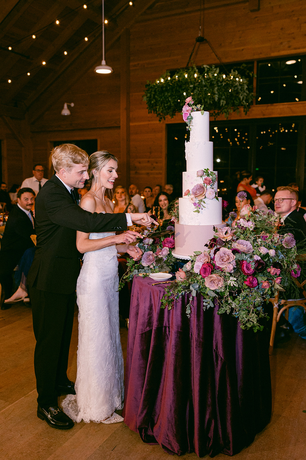 cake cutting at the lake house wedding 