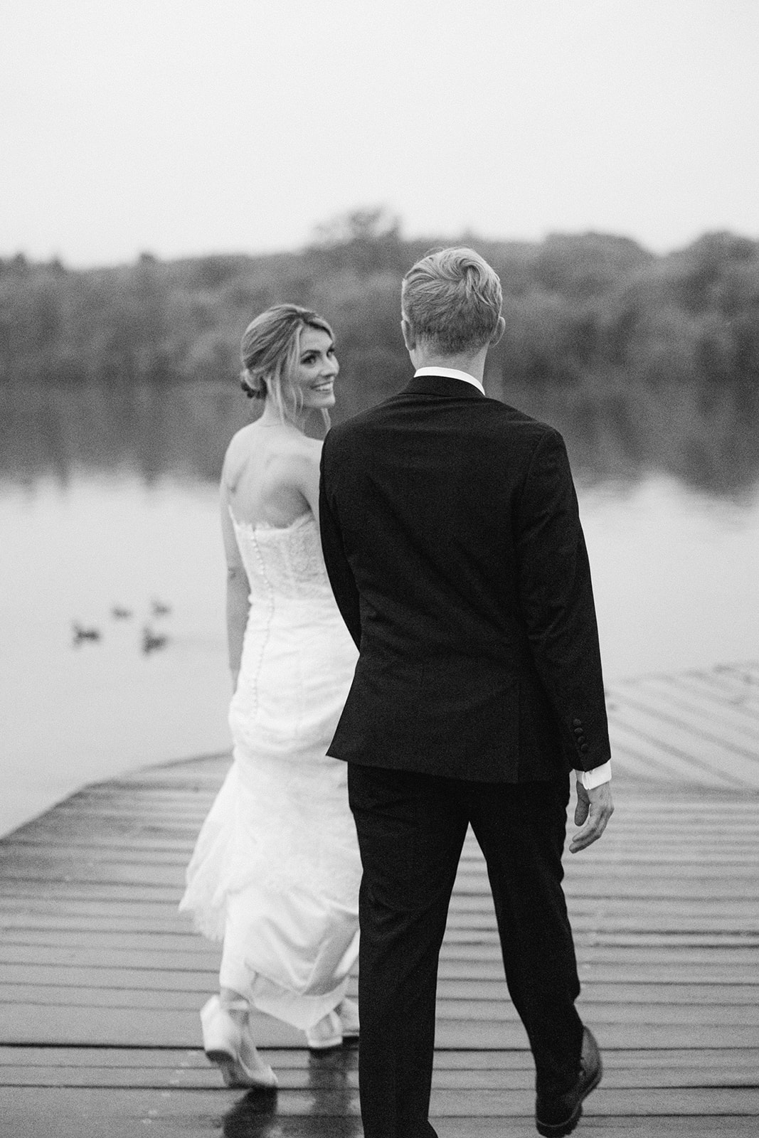 lake side portraits of the bride and groom 