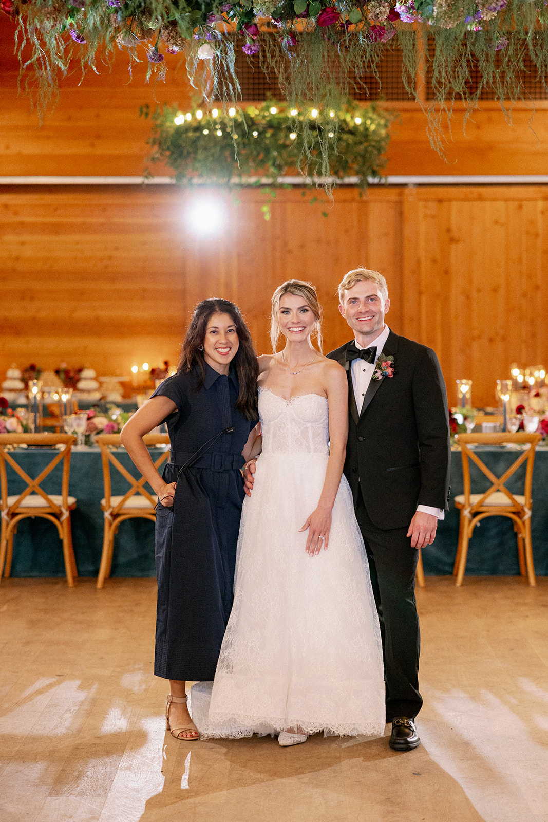 bride and groom with their event planner 