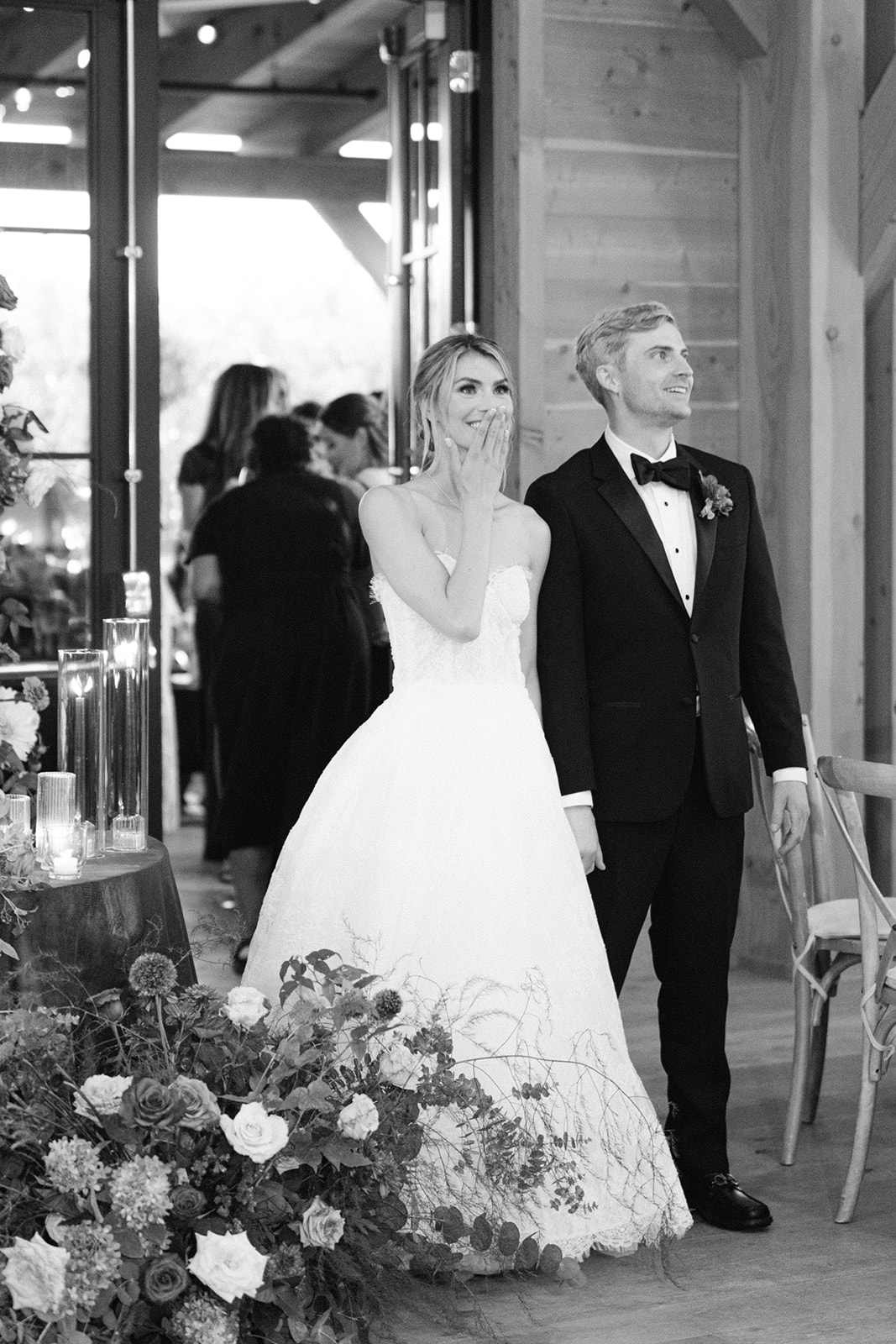 bride and groom overwhelmed with joy at the sight of the reception space at their lake house wedding 