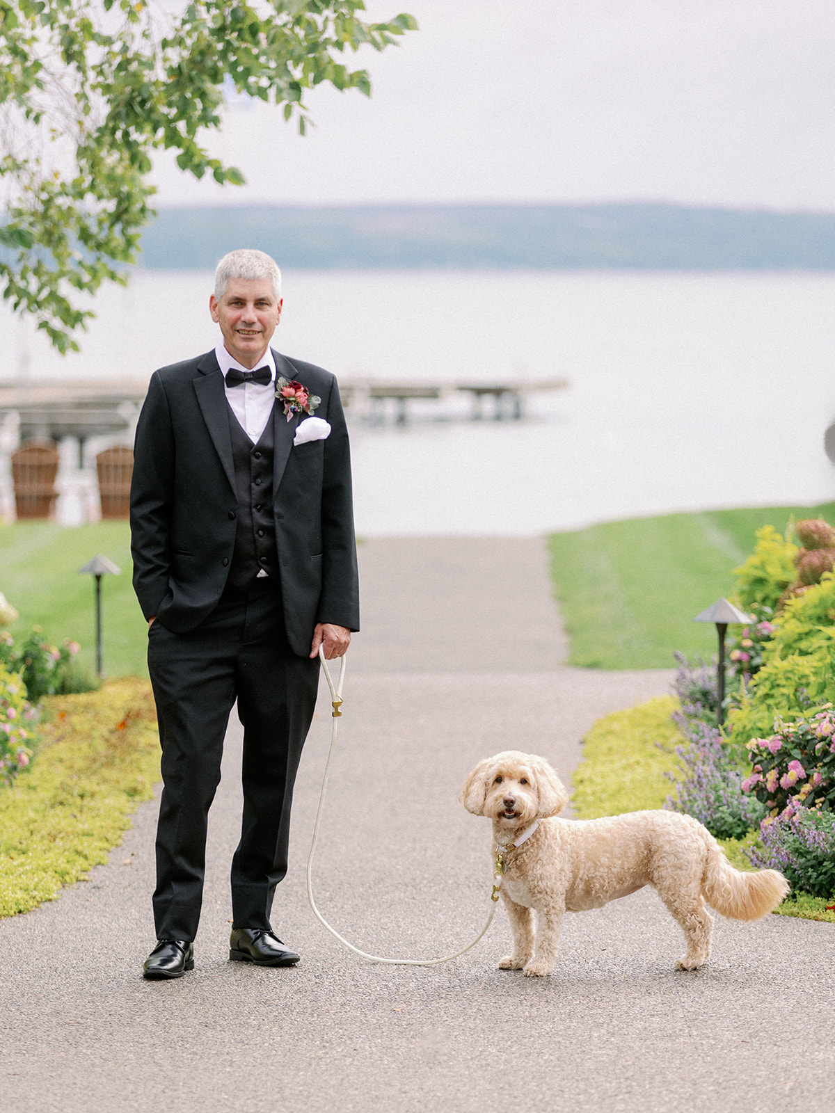 father with dog wedding on the lake