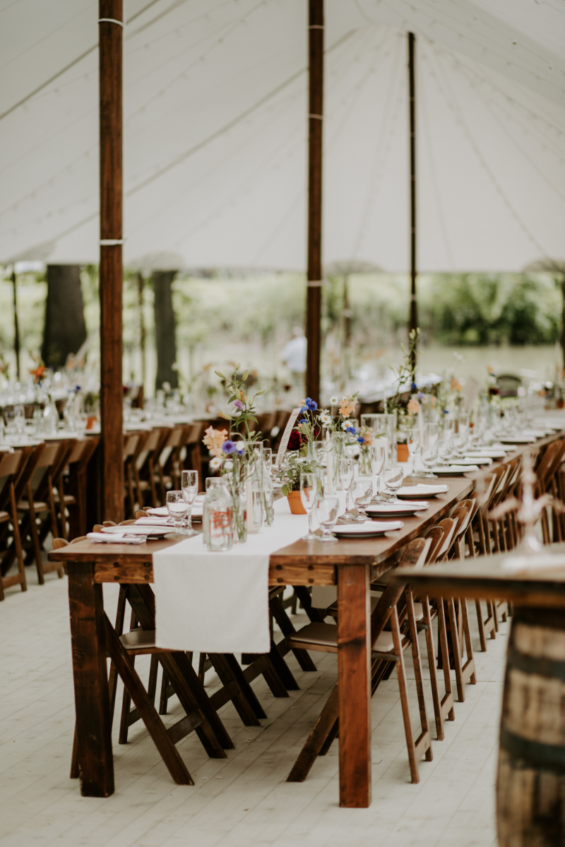 Outdoor Wedding Reception Table under Outdoor Wedding Tent