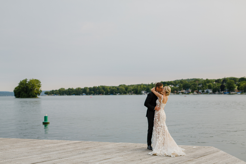 Bride and groom wedding photos kissing at The Lake House on Canandaigua