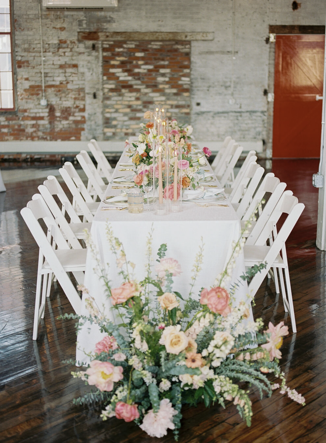 wedding reception table decor with flowers on the ground