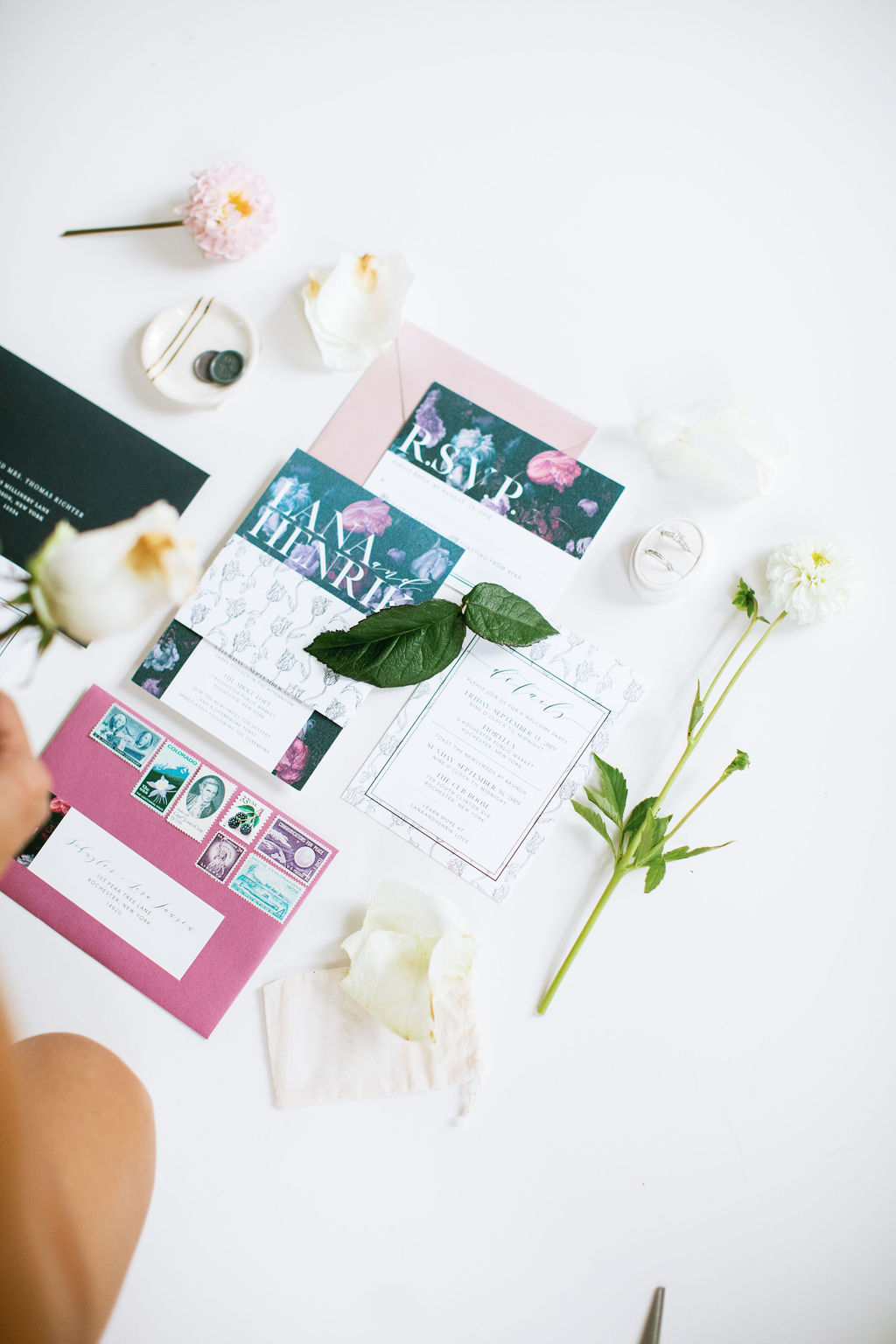 a wedding planner organizing a wedding invitation suite