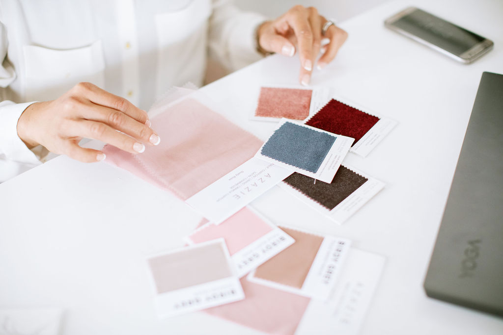 a wedding planner looking at color swatches