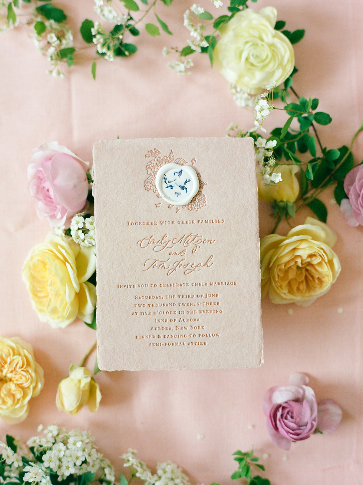 flat lay of colorful wedding invitations