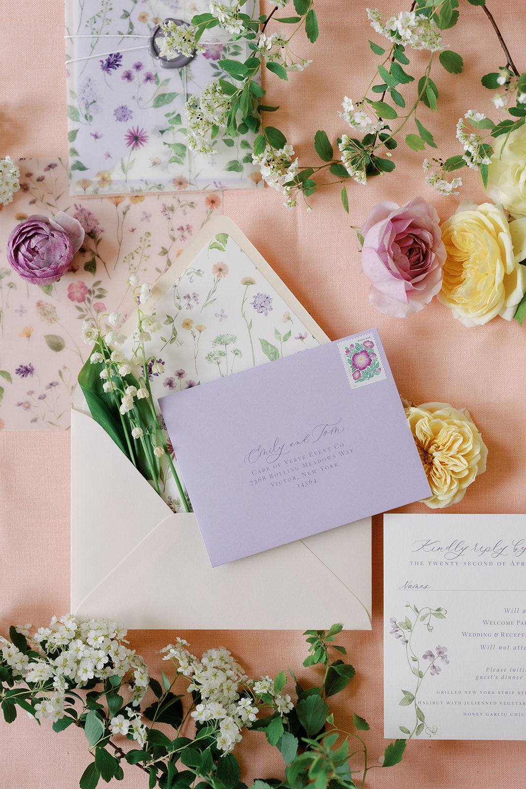 flat lay of colorful wedding invitations