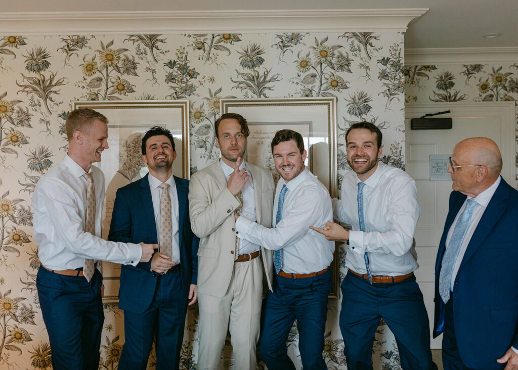 groom and groomsman getting ready