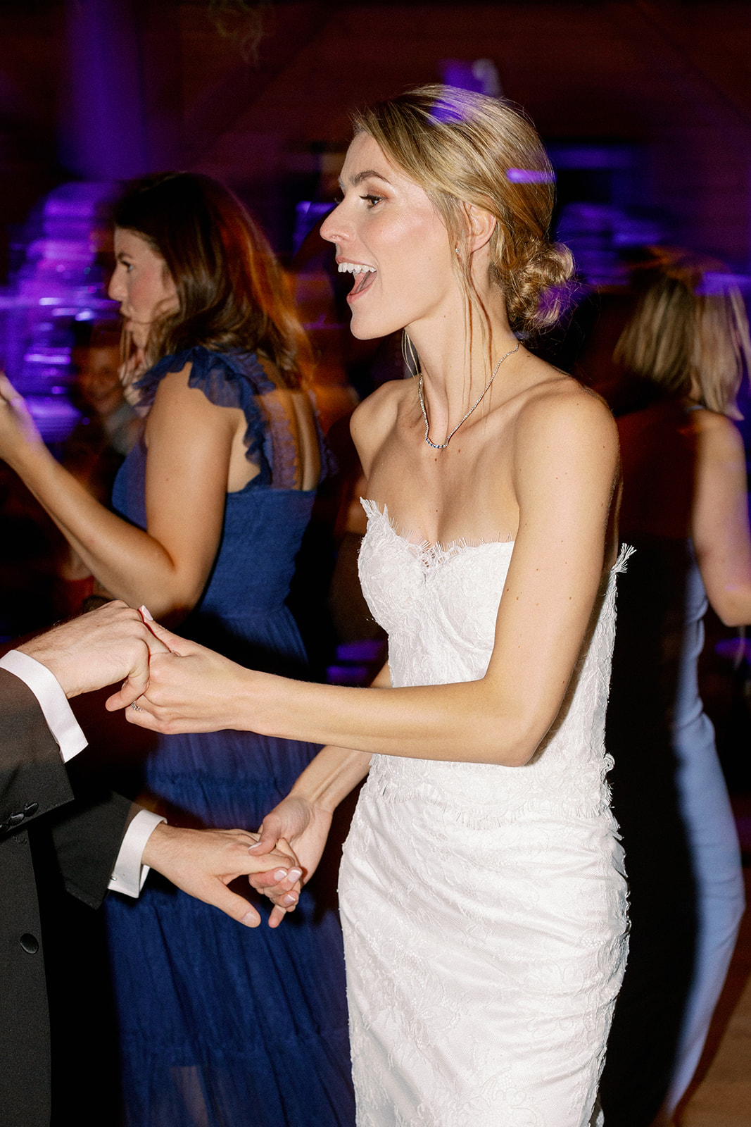 happy bride dancing at wedding 