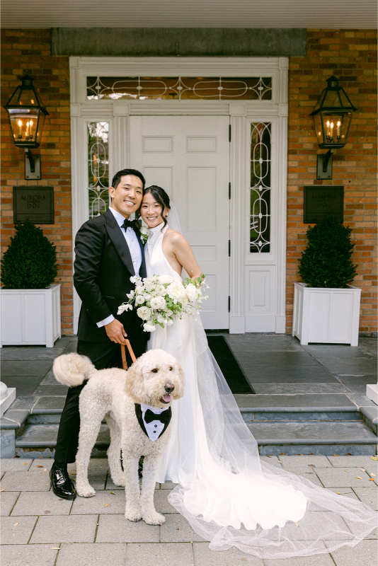 bride and groom with their dog