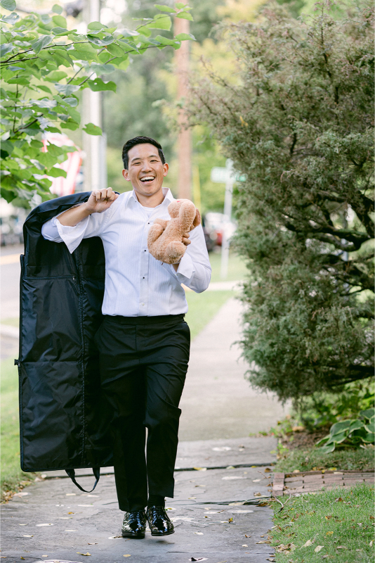 groom walking in to get ready for inns of aurora wedding in new York