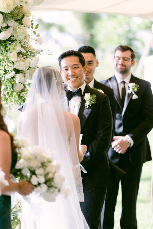 groom looking at his bride lovingly