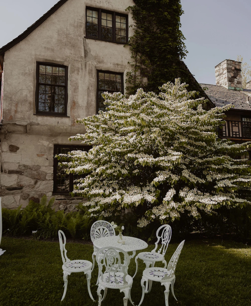 Troutbeck lawn with white lawn furniture. 