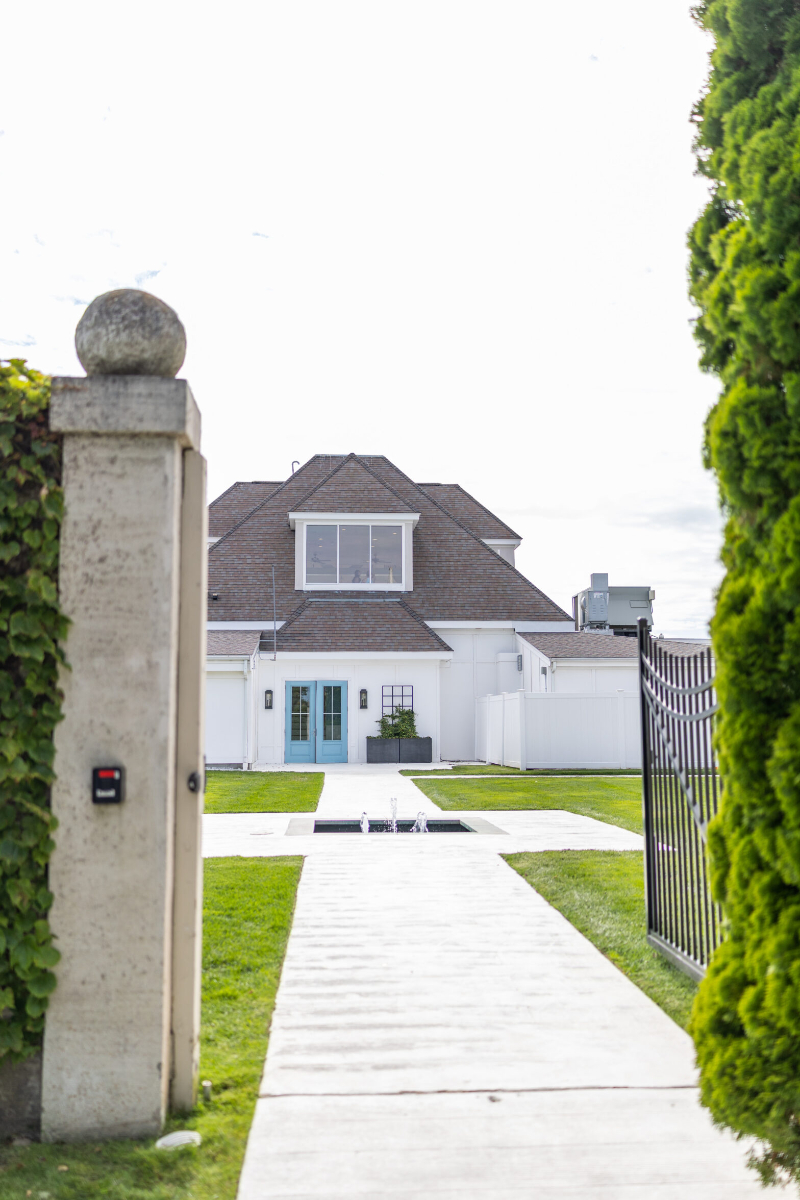 Shot of gate entering The Island House at Belle Mer: A Longwood Venue, popular coastal Rhode Island wedding venue.
