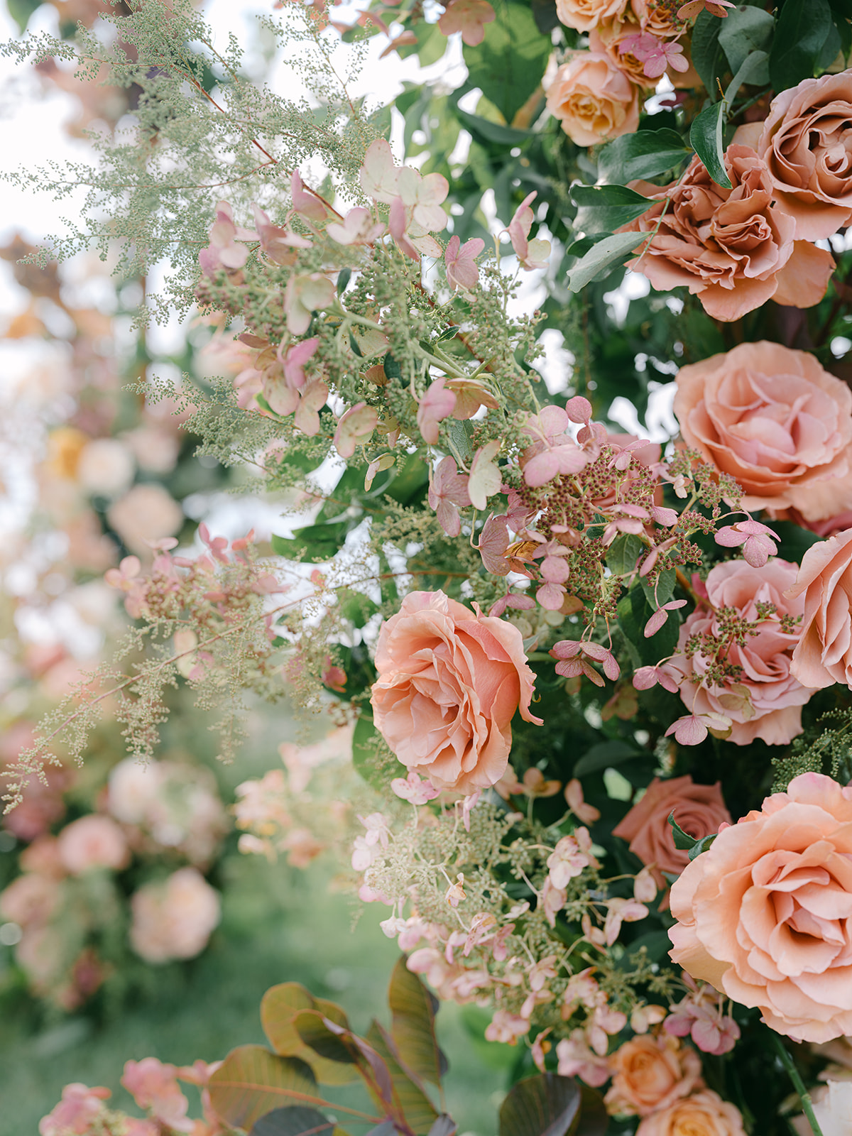 Floral details on arch for wedding ceremony at Inns of Aurora.