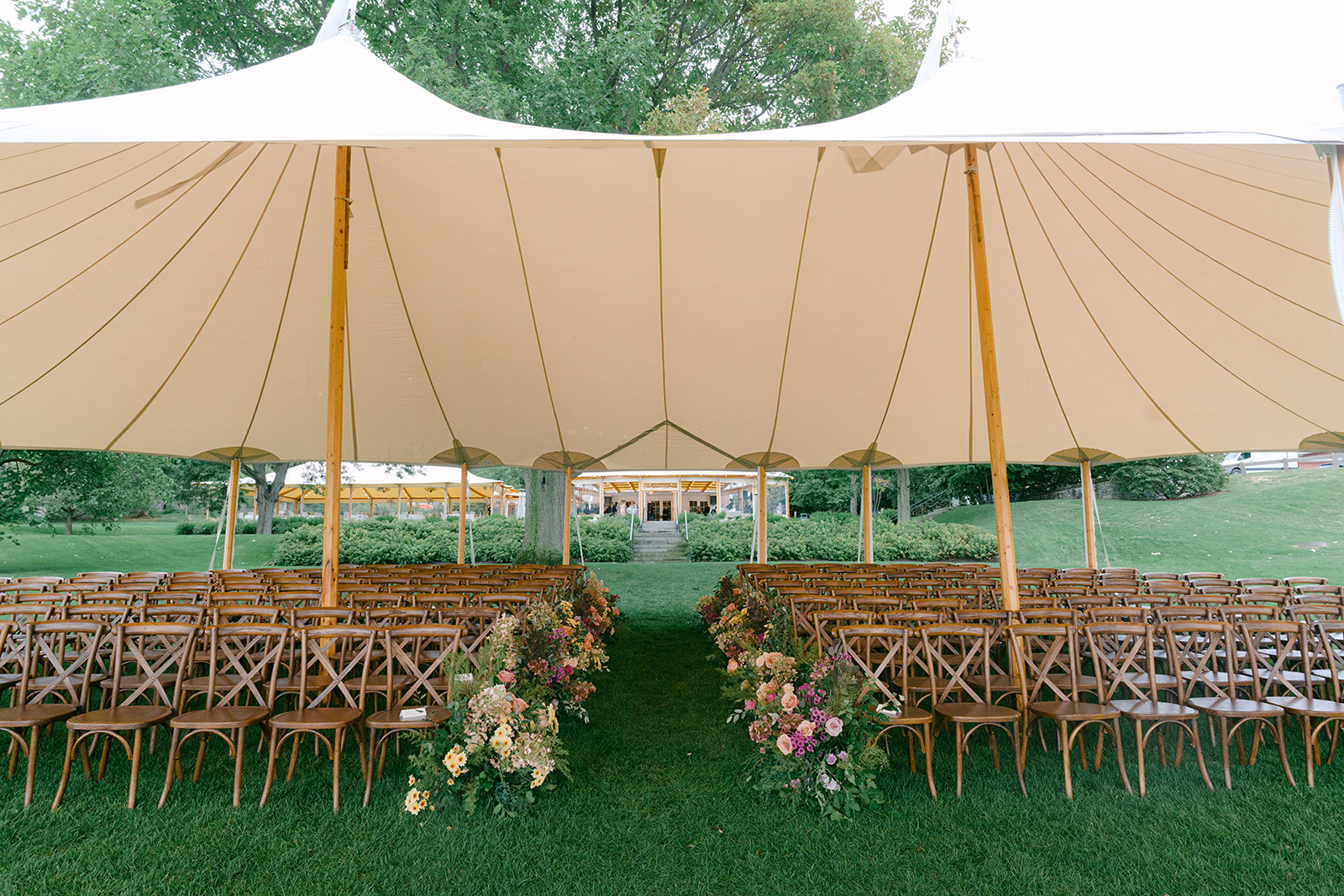 Tented ceremony at Inns of Aurora with fall wedding design tied throughout.