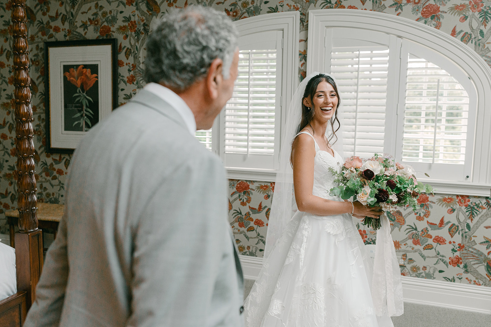Dad's admires daughter during the first look in her wedding dress.