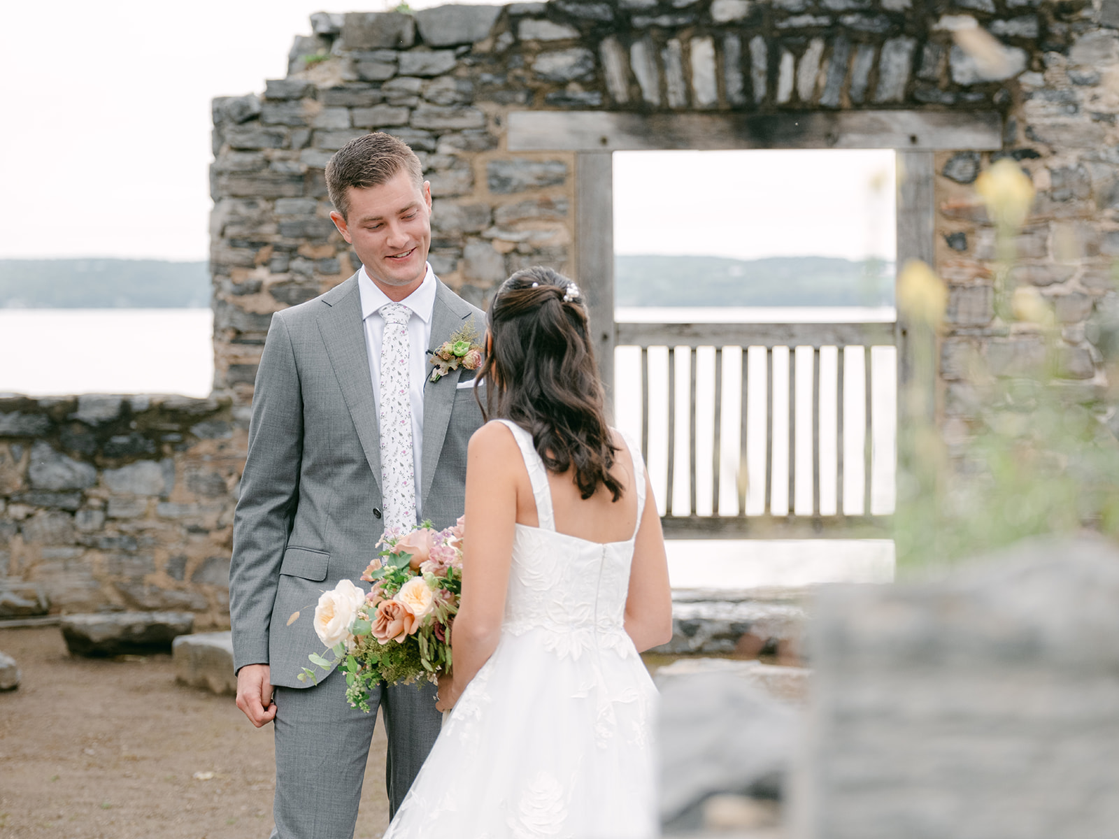 Bride and groom exchange first look in ruins at Inns of Aurora.