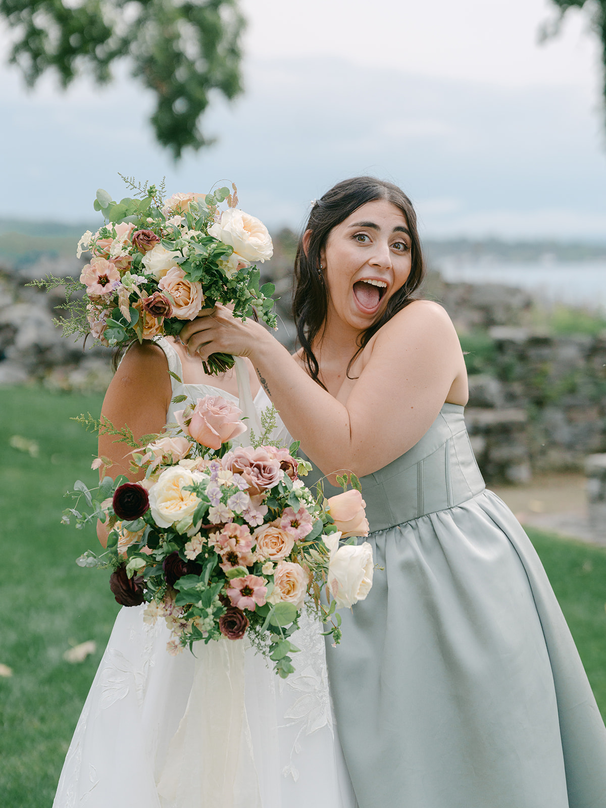 Bride takes silly photo with her sister.