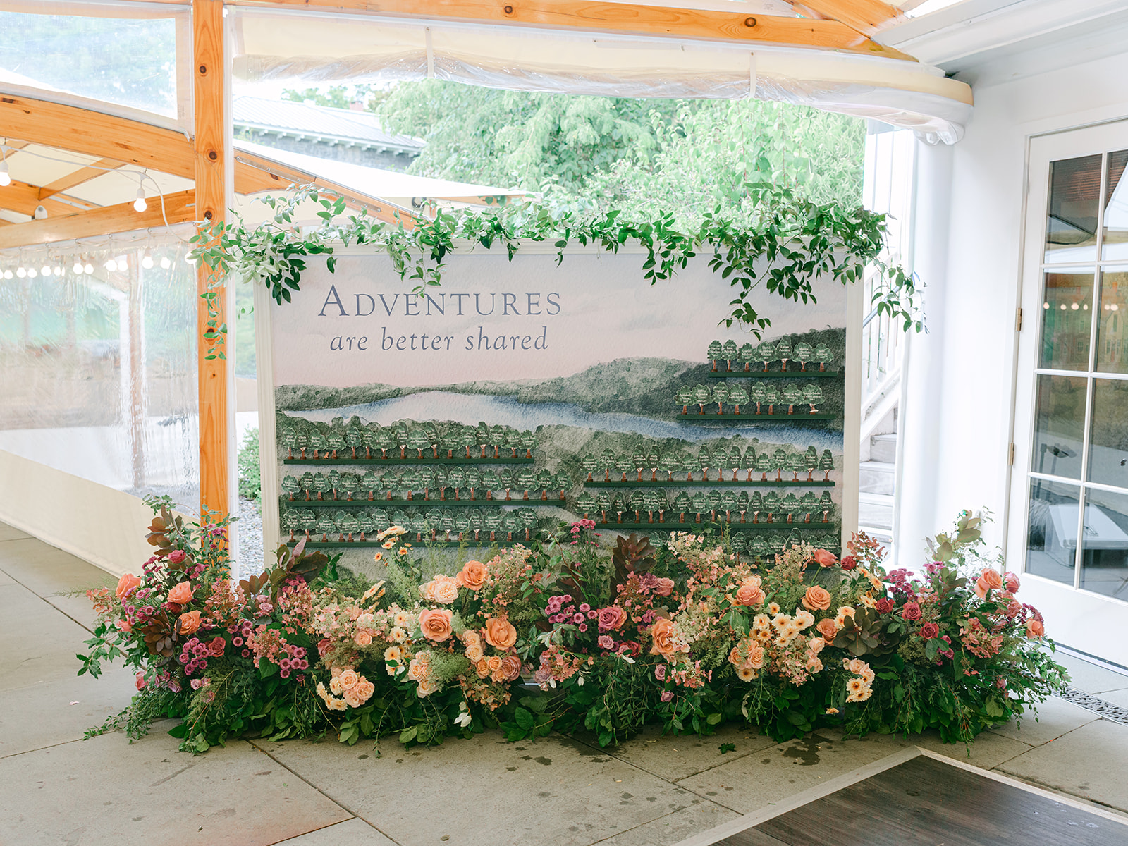 Escort card display with personal details for a fall wedding design at Inns of Aurora.