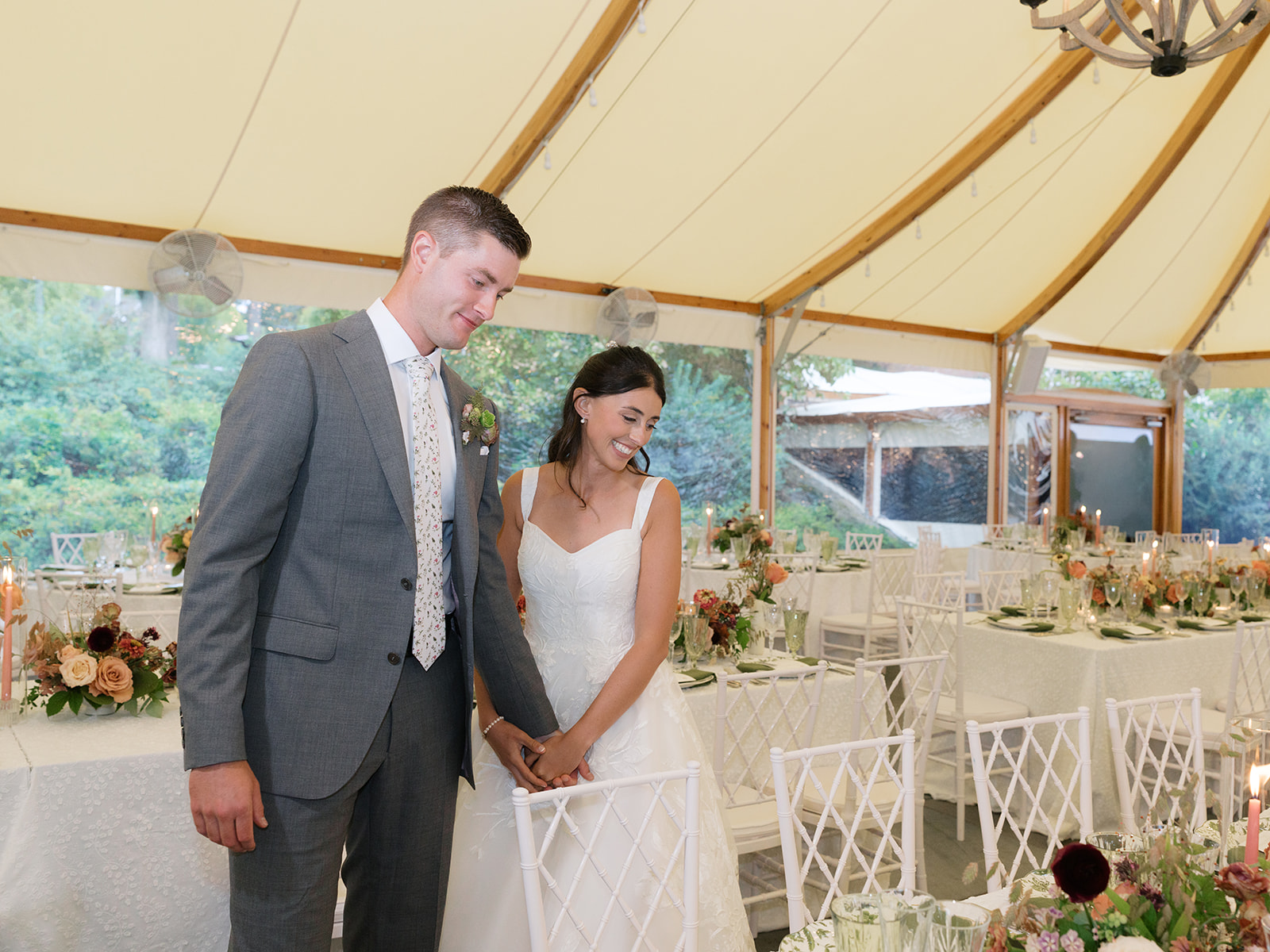Bride and groom's reaction during fall wedding design reception reveal.