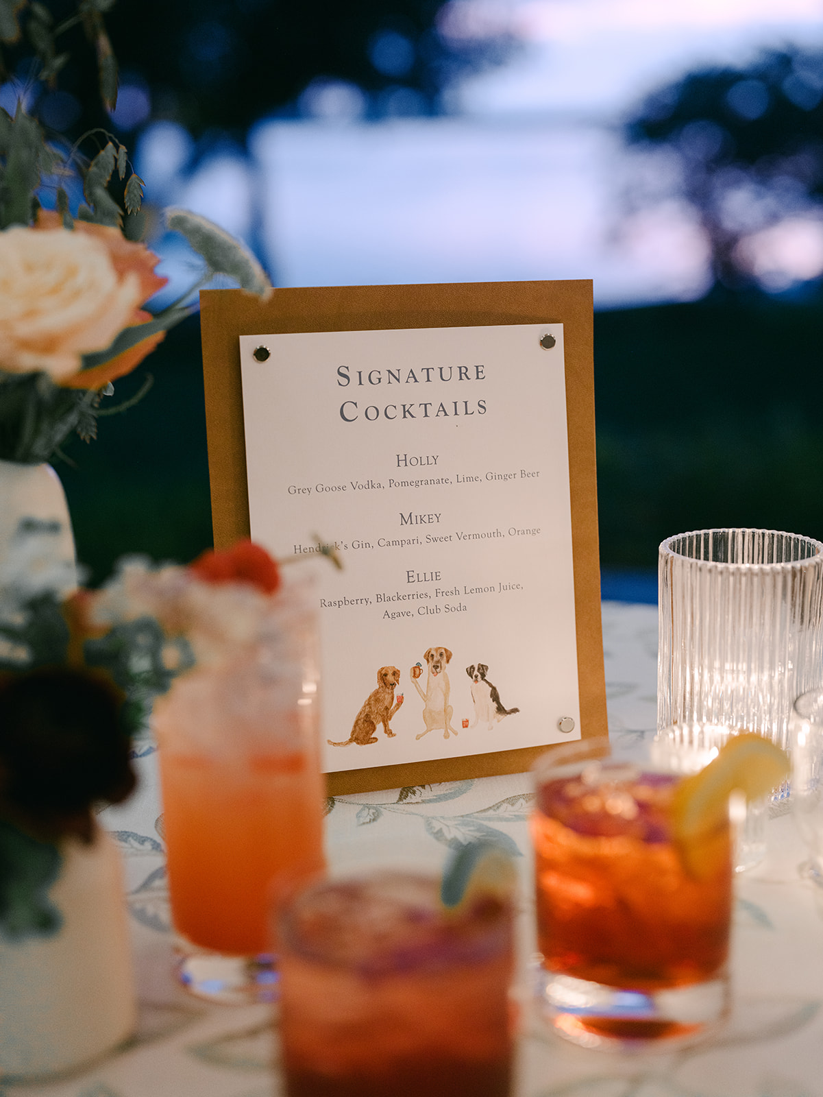 Signature cocktails sitting in front of sign for wedding.