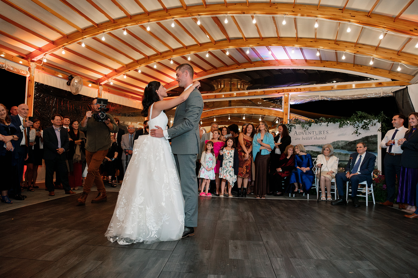 Bride and groom share dance during wedding at Inns of Aurora.