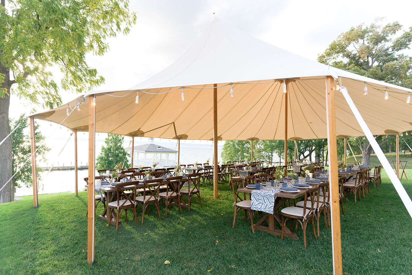 Tented wedding welcome dinner with fall wedding design.