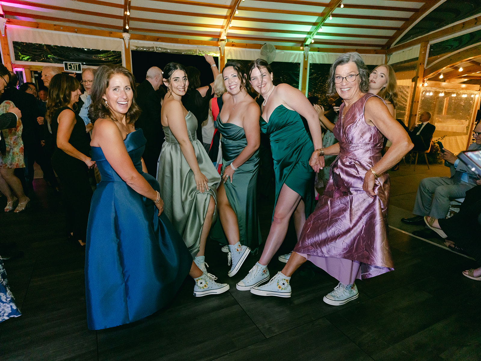 Wedding party shows off their dancing shoes.