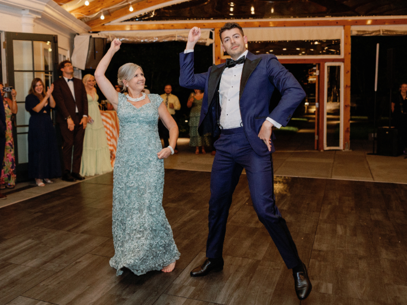 Groom and his mother share a fun dance during wedding reception.