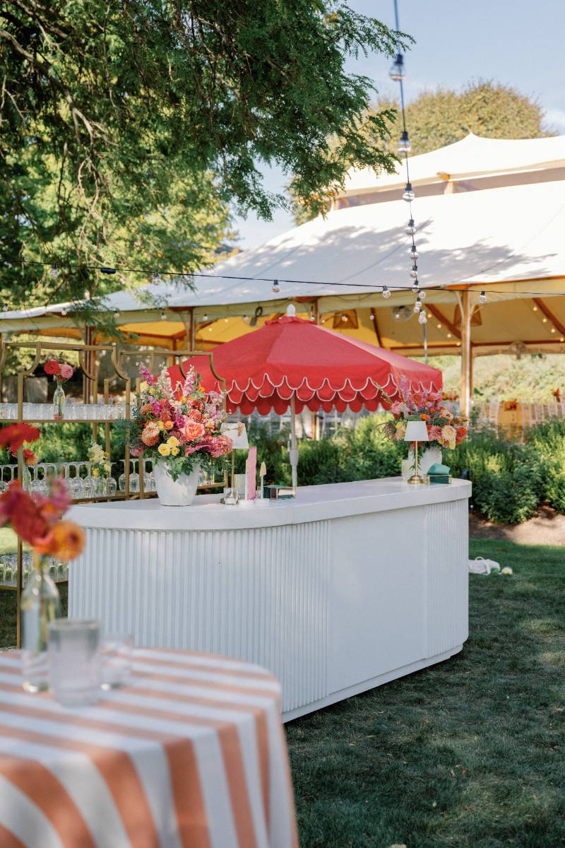 Bar front for Slim Aarons inspired wedding cocktail hour.