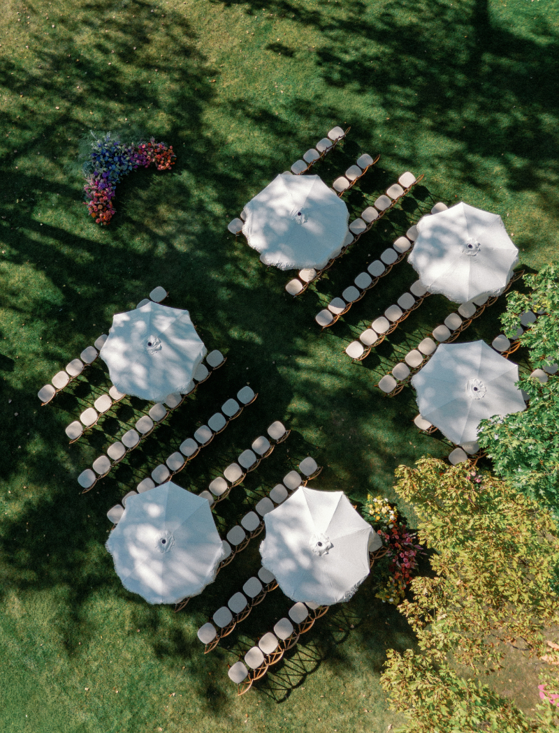 Aerial view of ceremony layout for Slim Aarons inspired wedding at Inns of Aurora .