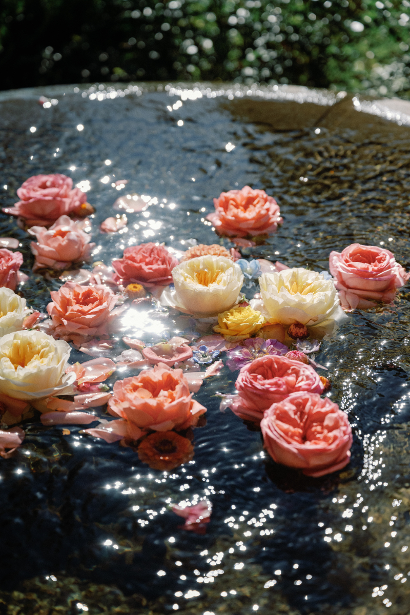 Wedding florals floating in water.