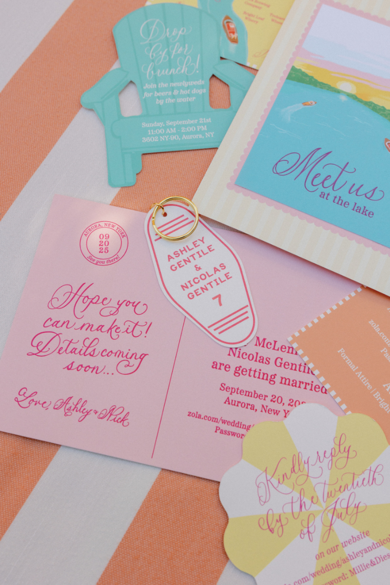 Slim Aarons inspired wedding stationary arranged in flatlay with florals.