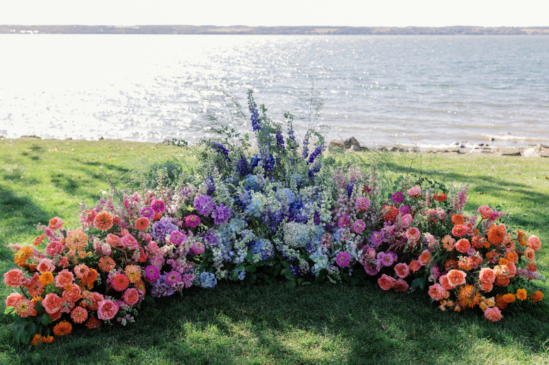 Colorful floral meadow for Slim Aarons inspired wedding at Inns of Aurora.