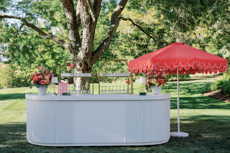 Bar front for Slim Aarons inspired wedding cocktail hour.