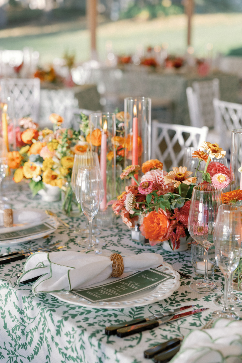 Table setting for Slim Aarons inspired wedding reception at Inns of Aurora.