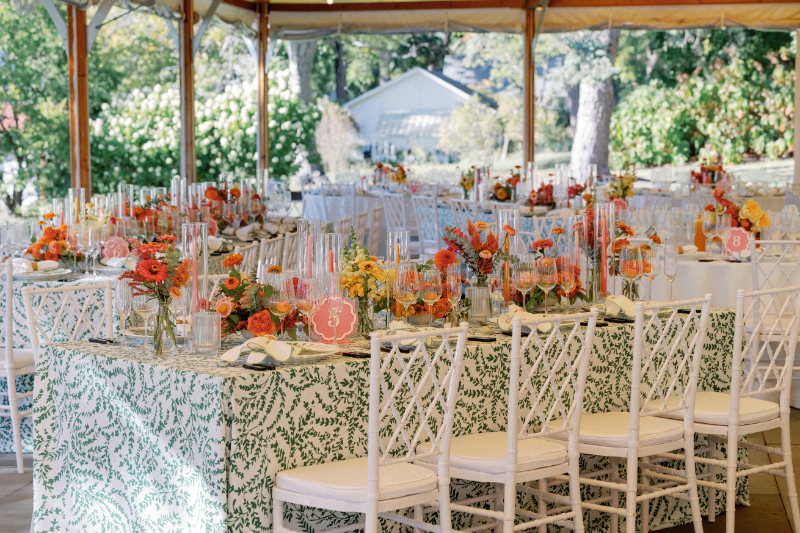 Reception table setting for Slim Aarons inspired wedding at Inns of Aurora.