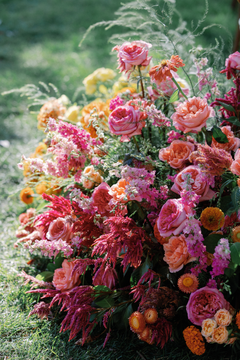 Closeup of aisle arrangements for Slim Aarons inspired wedding ceremony.