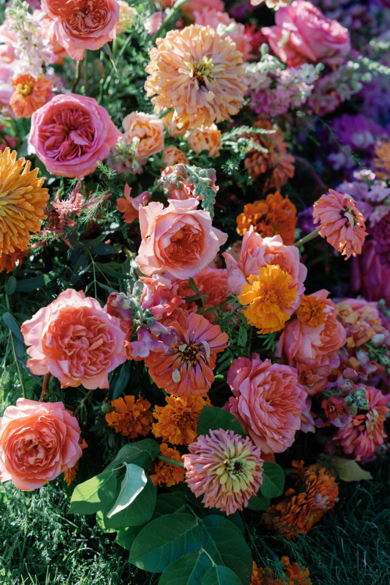 Close up of colorful wedding florals for Slim Aarons inspired wedding.