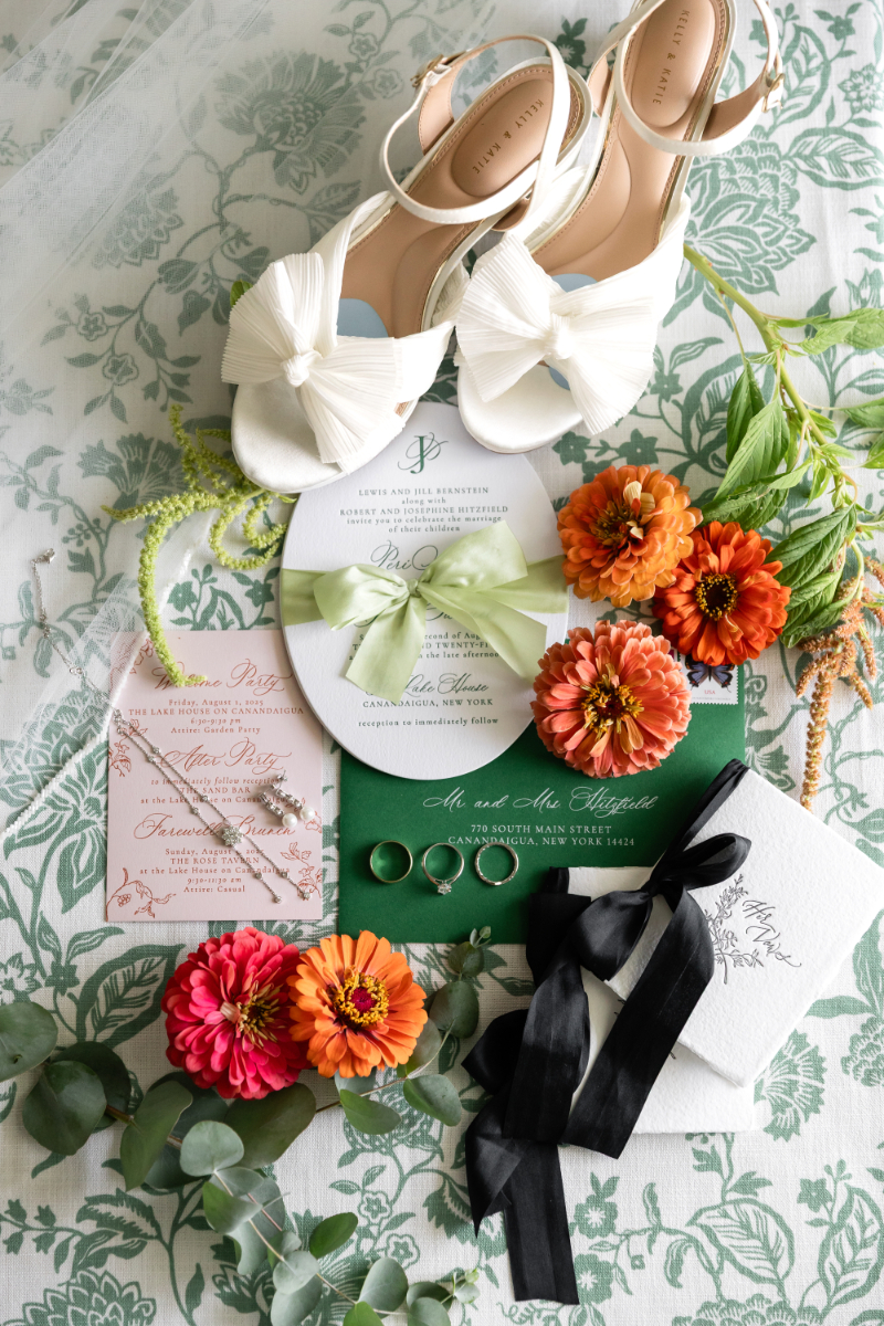 Flatlay of summer camp wedding details.