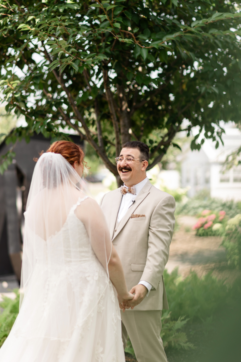 Bride and groom share joy-filled first look before their wedding ceremony.