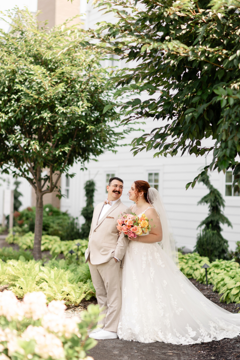 Bride and groom pose for portraits before wedding ceremony at the Lake House on Canandaigua.
