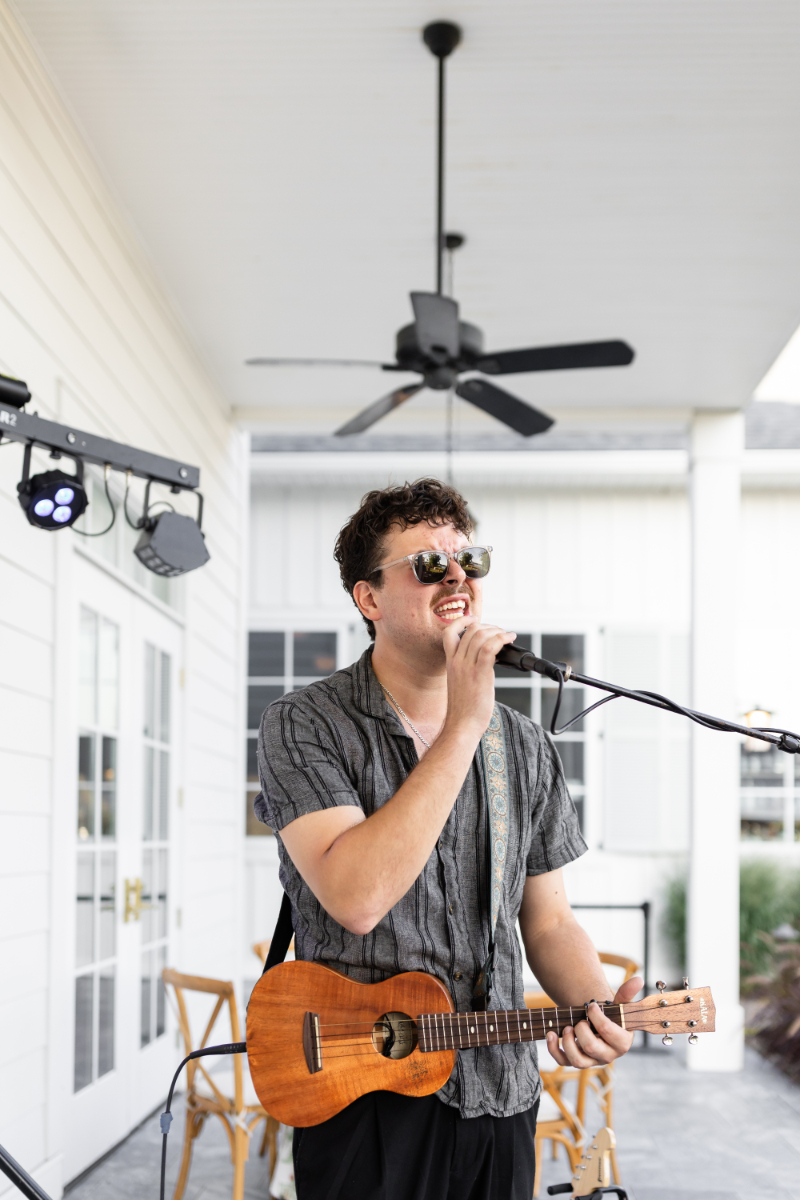 Musician sings during wedding welcome party.
