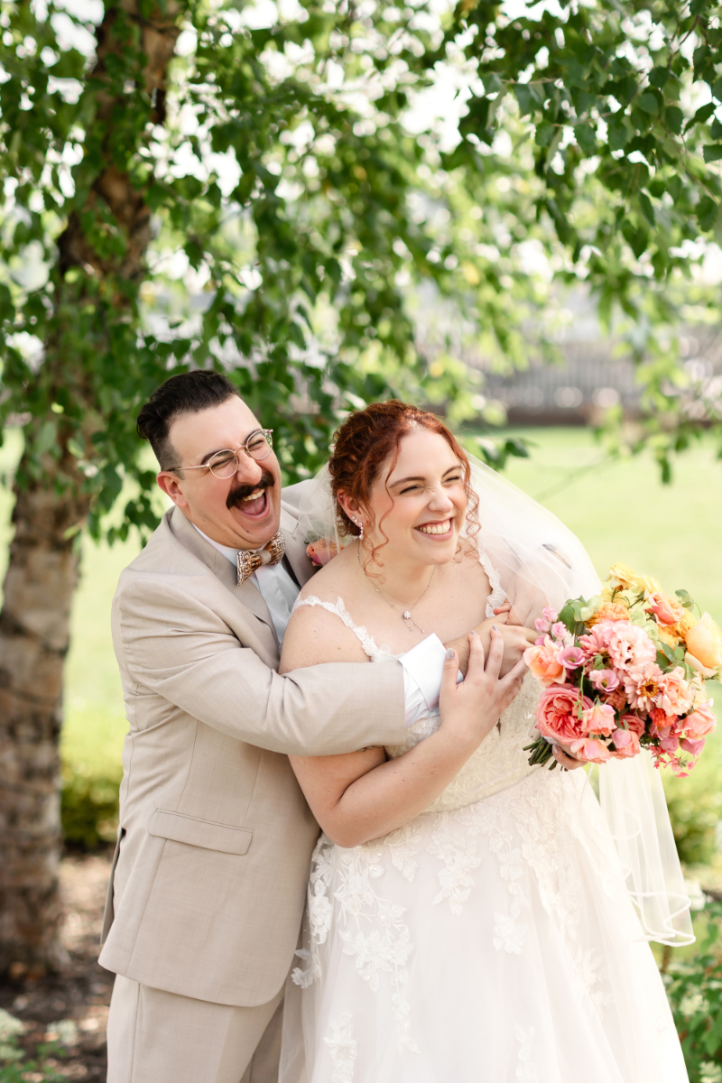 Bride and groom pose for portraits before wedding ceremony at the Lake House on Canandaigua.