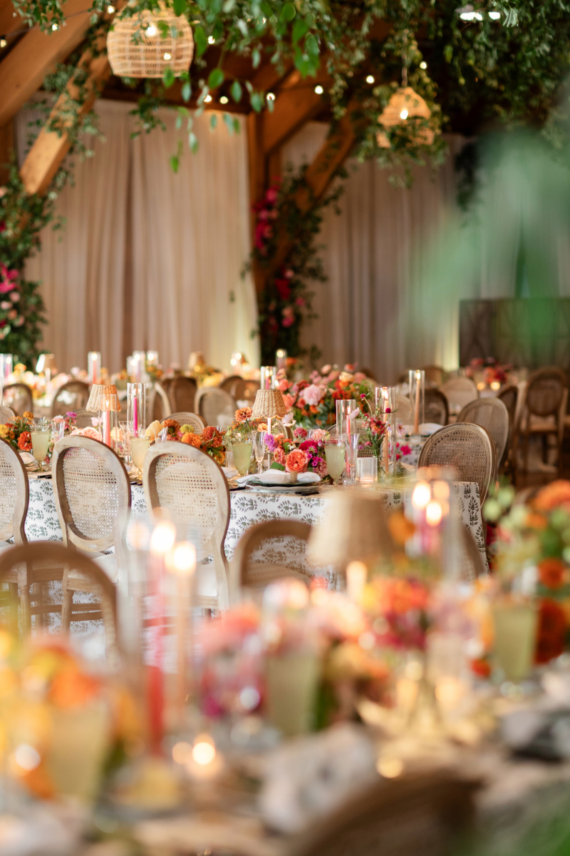 Summer camp wedding decorated with colorful florals.
