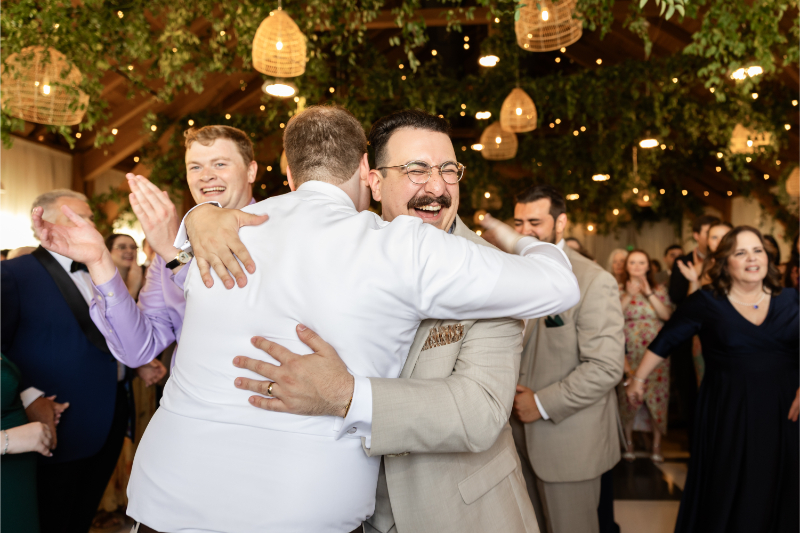Groom hugs friend after the Hora.